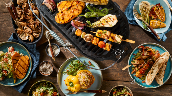 Vegetarian barbecue with grilled vegetables on a wooden table